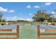 Outdoor pickleball courts with benches and fencing, providing a recreational amenity for residents at 4550 County Road 104, Oxford, FL 34484