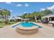 Inviting pool area with comfortable lounge seating and outdoor dining, perfect for summer days at 4550 County Road 104, Oxford, FL 34484