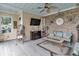 Cozy porch with brick accent wall, fireplace, and comfortable seating at 4550 County Road 104, Oxford, FL 34484
