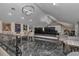 Upstairs theater room with tiered seating, plush chairs, and a large projection screen for immersive entertainment at 4550 County Road 104, Oxford, FL 34484