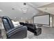 Home theater with plush seating and large screen, designed for an immersive viewing experience at 4550 County Road 104, Oxford, FL 34484