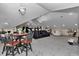 Theater room setup with movie recliners, tables, and snack bar, perfect for a comfortable viewing experience at 4550 County Road 104, Oxford, FL 34484