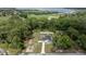 Aerial view of a single-Gathering home with large backyard and surrounded by trees at 5063 Se 168Th Ter, Ocklawaha, FL 32179
