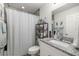 This bathroom has a vanity, a toilet, and a shower-tub combo with modern fixtures and great storage at 5063 Se 168Th Ter, Ocklawaha, FL 32179