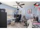 Bright bedroom featuring a ceiling fan, work space, playful decor, and a well-lit area for work and creativity at 5063 Se 168Th Ter, Ocklawaha, FL 32179