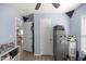 This bedroom has a ceiling fan, multiple doorways, hard surface floors, and ample space for storage at 5063 Se 168Th Ter, Ocklawaha, FL 32179