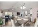 Open living space with a dining area, comfortable sectional sofa, and bright lighting at 5063 Se 168Th Ter, Ocklawaha, FL 32179