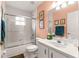 Tiled bathroom with glass-enclosed tub/shower and updated vanity offering a clean and modern look at 5445 Ne Anthony Rd, Ocala, FL 34475