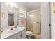 This bathroom includes a vanity, toilet, and shower with a glass door at 5445 Ne Anthony Rd, Ocala, FL 34475