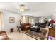 This expansive living room features a large rug, leather sofas, and natural lighting at 5445 Ne Anthony Rd, Ocala, FL 34475