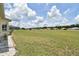 Expansive backyard with a well-manicured lawn and views of the surrounding area at 5551 Nw 25Th Loop, Ocala, FL 34482