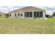 Spacious screened in patio and well-maintained backyard offers great outdoor living space at 5551 Nw 25Th Loop, Ocala, FL 34482