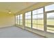 Bright sunroom with large windows that offer abundant light and views of the yard at 5551 Nw 25Th Loop, Ocala, FL 34482