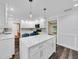 Spacious, bright kitchen featuring white cabinets, stainless steel appliances and quartz countertops at 616 Se 40Th Ave, Ocala, FL 34471