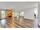 Spacious living room with brick fireplace and sliding door leading to the exterior at 616 Se 40Th Ave, Ocala, FL 34471