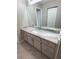 Bathroom featuring marble countertop, neutral walls, cabinetry, and tile flooring at 6241 Sw 84Th Pl, Ocala, FL 34476
