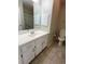Traditional bathroom featuring a white vanity with marble-look tile floors and neutral walls at 6241 Sw 84Th Pl, Ocala, FL 34476