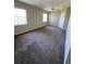 Spacious bedroom with neutral tones, ceiling fan, and two windows, providing ample natural light at 6241 Sw 84Th Pl, Ocala, FL 34476
