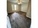 Carpeted bedroom offering natural light with a ceiling fan providing comfort and functionality at 6241 Sw 84Th Pl, Ocala, FL 34476