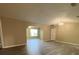 Bright living room with updated vinyl floors, a ceiling fan, and neutral paint at 6241 Sw 84Th Pl, Ocala, FL 34476