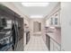Well-lit kitchen featuring tile floors and modern appliances at 6320 Se 42Nd Ct, Ocala, FL 34480