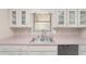 Close up of kitchen sink and counters with tiled floors at 6320 Se 42Nd Ct, Ocala, FL 34480