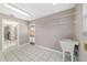 Bright laundry room featuring a utility sink, tile flooring, and wire shelving for ample storage at 6320 Se 42Nd Ct, Ocala, FL 34480