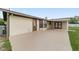 Expansive concrete patio offering ample space for outdoor seating and entertainment at 6320 Se 42Nd Ct, Ocala, FL 34480