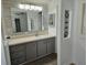 Stylishly updated bathroom with modern mirrors and beautiful vanity at 741 Truman Ave, Lady Lake, FL 32159