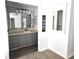 Updated bathroom features modern lighting, storage, and stylish finishes at 741 Truman Ave, Lady Lake, FL 32159