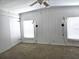 Cozy bedroom with built in storage, plush carpet, and natural lighting at 741 Truman Ave, Lady Lake, FL 32159