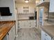 Bright and clean kitchen with wood countertops and updated hardware at 741 Truman Ave, Lady Lake, FL 32159