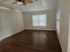 Neutral toned Living room with wood look floors, ceiling fan and lots of light at 741 Truman Ave, Lady Lake, FL 32159