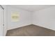 Carpeted bedroom featuring a window that provides natural light at 7513 Sw 56Th Pl, Ocala, FL 34474