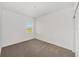 Bright, carpeted bedroom with a window letting in natural light at 7513 Sw 56Th Pl, Ocala, FL 34474