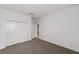 Neutral carpeted bedroom with standard closet and view to hallway at 7513 Sw 56Th Pl, Ocala, FL 34474