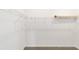 Walk-in closet features neutral carpet and white wire shelving for ample storage at 7513 Sw 56Th Pl, Ocala, FL 34474