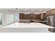 Gourmet kitchen with stainless steel appliances and center island perfect for entertaining in this open-concept home at 7513 Sw 56Th Pl, Ocala, FL 34474