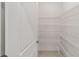 A walk-in pantry with metal shelves provides ample storage space at 7513 Sw 56Th Pl, Ocala, FL 34474