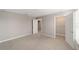 Carpeted bedroom showing an open closet door and access to a walk-in closet at 7745 Sw 56Th Pl, Ocala, FL 34474