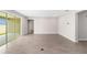 Bright and airy living room with large sliding glass doors and tile flooring, perfect for entertaining at 7745 Sw 56Th Pl, Ocala, FL 34474