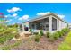 A beautiful backyard with a covered patio and lush landscaping at 7891 Sw 89Th Cir, Ocala, FL 34481