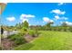 Backyard featuring a lush lawn and mature landscaping at 7891 Sw 89Th Cir, Ocala, FL 34481