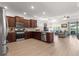 Modern kitchen featuring stainless steel appliances and dark wood cabinetry at 7891 Sw 89Th Cir, Ocala, FL 34481