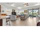 Bright living room with an open layout, view of the backyard, and modern furniture at 7891 Sw 89Th Cir, Ocala, FL 34481