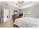 Serene main bedroom with a king bed, a dresser, and a view of the outdoors at 7891 Sw 89Th Cir, Ocala, FL 34481