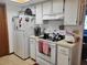 Functional kitchen with white appliances and ample cabinet space at 8368 Sw 105Th Pl, Ocala, FL 34481