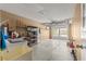 Clean garage with garage door, laundry sink, storage shelves, and space for two cars at 8625 Sw 94Th Ln # A, Ocala, FL 34481