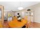 Cozy dining room with wood floors, overhead chandelier, and seamless access to the living area at 8670 Se 141St Pl, Summerfield, FL 34491