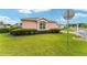 Charming single-story home featuring manicured lawn and trimmed hedges at 8670 Se 141St Pl, Summerfield, FL 34491